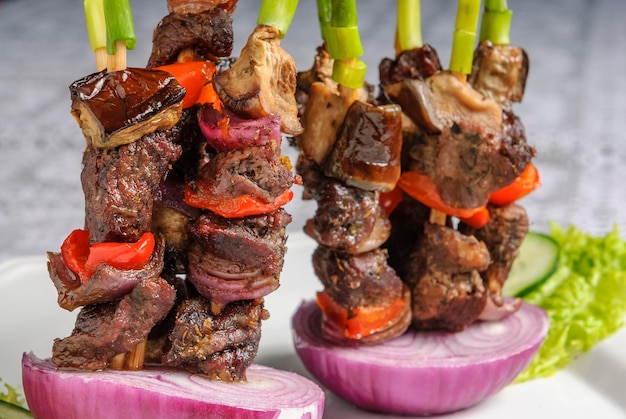 Brazilian barbecue skewer with meat and onion Kebabs grilled steak kebabs