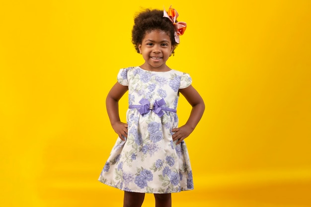 Brazilian black child with curly hair in studio shot with various facial expressions