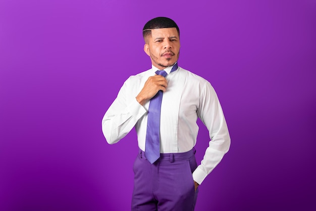 Brazilian black man dressed in business clothes and violet tie\
purple business man