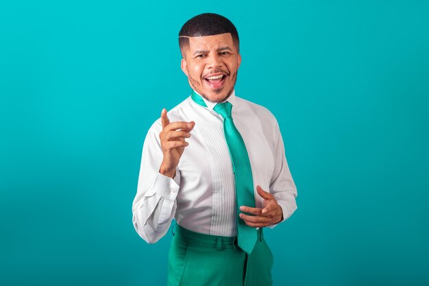 Brazilian black man dressed in white shirt green tie businessman posing for photo