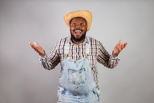 Brazilian black man wearing country clothes from festa junina festa de sao joao arraia incredible unbelievable