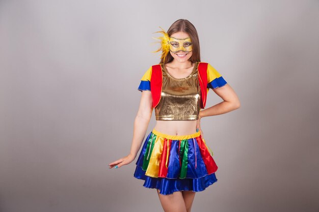 Brazilian blonde woman dressed in frevo clothes carnival mask and hand on her waist