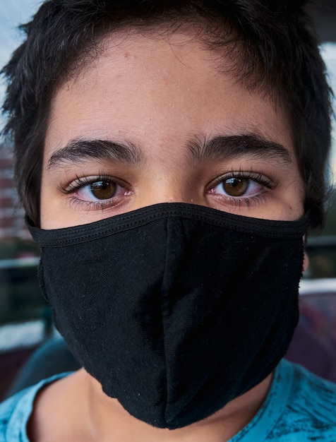 Brazilian Boy using mask during the quarantine.