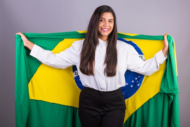 Brazilian businesswoman manager corporate portrait with brazil flag