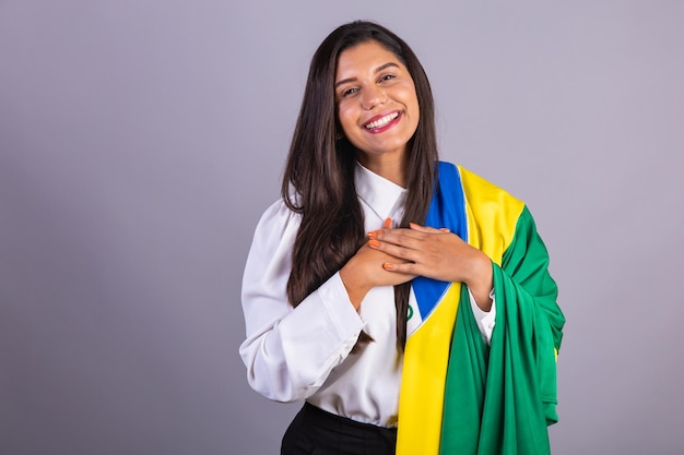 Brazilian businesswoman manager corporate portrait with brazil flag