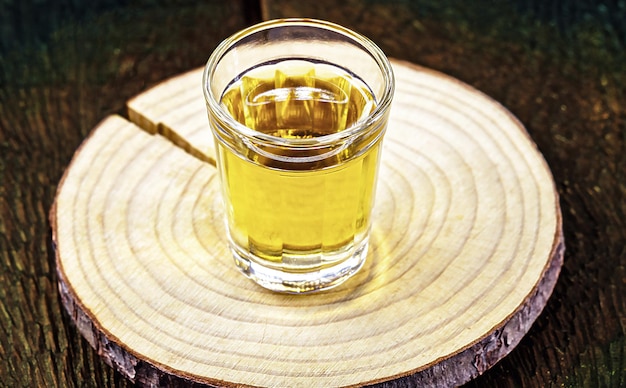 Brazilian cachaca glass with Brazilian flag texture in the bac