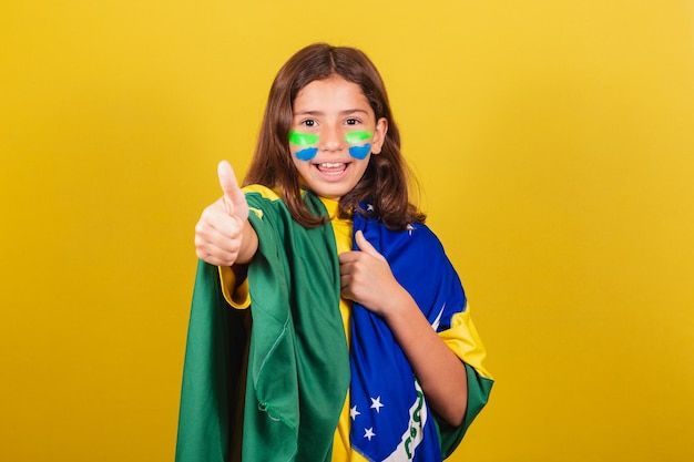 Brazilian caucasian child soccer fan thumb up approving approval affirmative World Cup Olympics