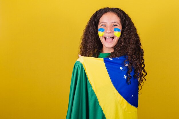 Brazilian caucasian football fan girl smiling happy cheering and partying