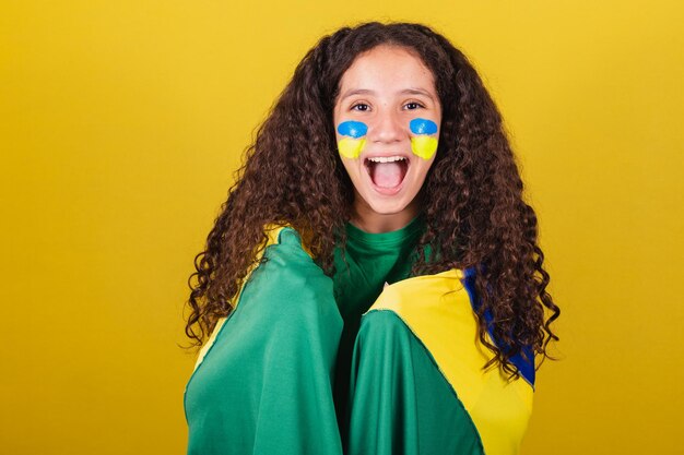 Brazilian Caucasian girl soccer fan screaming goal cheering and partying