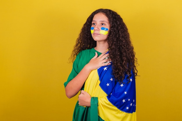 Brazilian Caucasian girl soccer fan Singing national anthem Nationalism