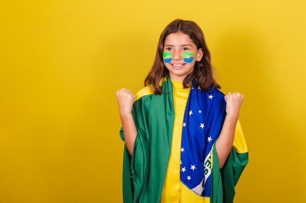 Brazilian caucasian soccer fan arms raised celebrating confident and joyful world cup olympics