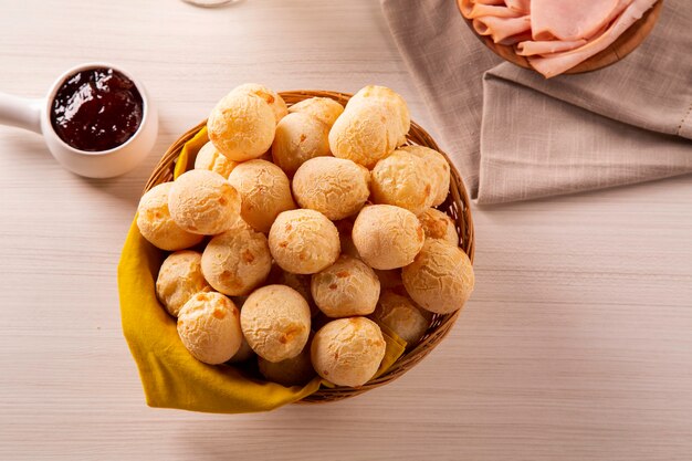 Brazilian cheese buns . Table coffee in the morning with cheese bread in basket.