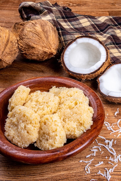 Brazilian coconut candy on wooden table