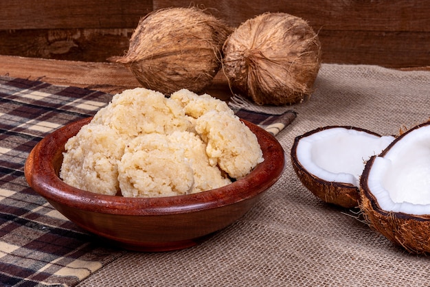 Brazilian coconut candy on wooden table