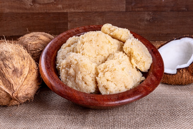 Brazilian coconut candy on wooden table