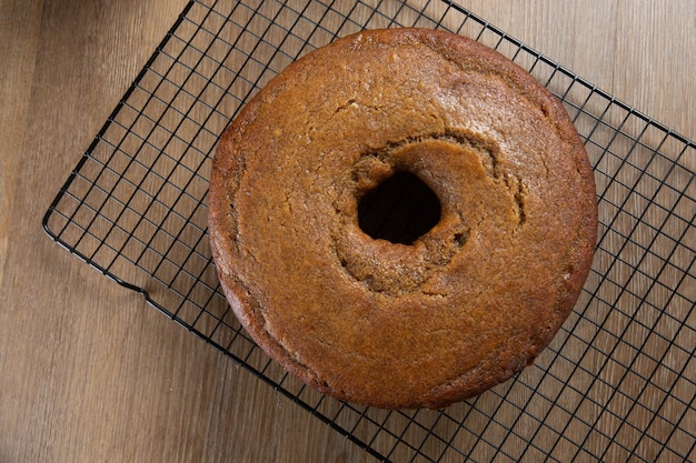 Brazilian corn cake made with a type of corn flour Fuba On a wooden party table Typical sweets of the June festival Cornmeal cake Top view