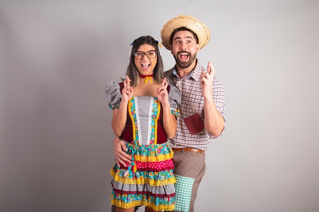 Brazilian couple dressed in festa junina clothes feast of Sao Joao hoping wishing