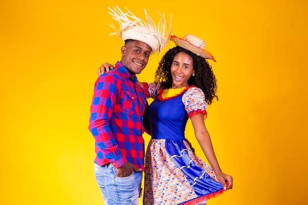 Brazilian couple wearing traditional clothes for festa junina june festival