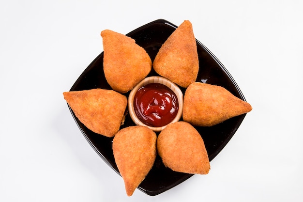 Brazilian Coxinha on a white space.