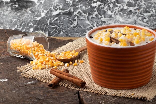 Brazilian dessert canjica made with corn cinnamon and coconut flakes