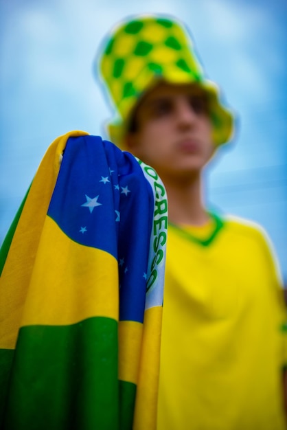 Brazilian fan celebrating and cheering for the Brazil national team at the World Cup