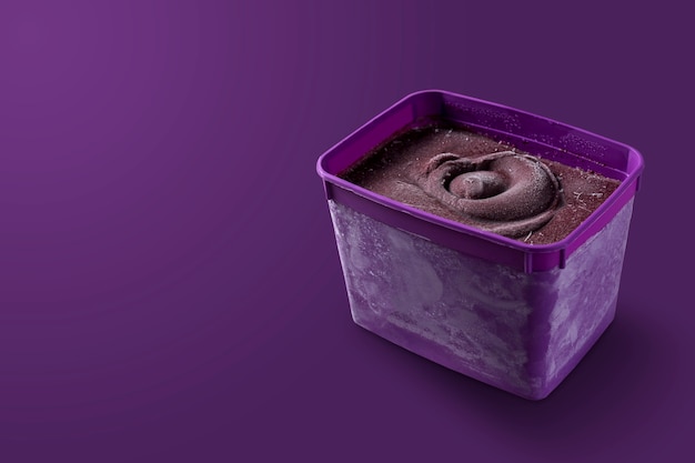 Brazilian frozen and acai berry ice cream purple bowl box. isolated on purple background. Summer menu front view