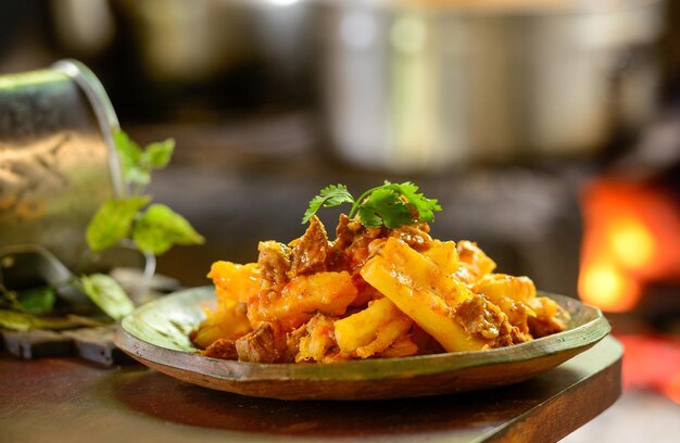 Brazilian gastronomy Goat meat stewed with cassava