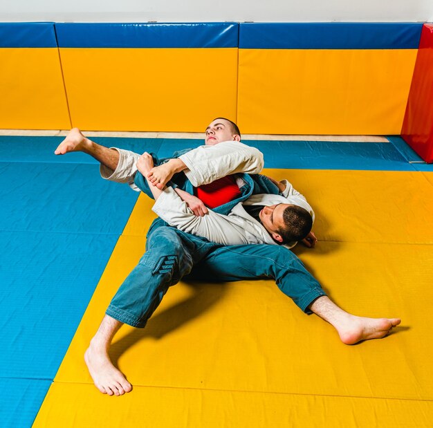 Brazilian jiujitsu and grappling training for men in a selfdefense gym