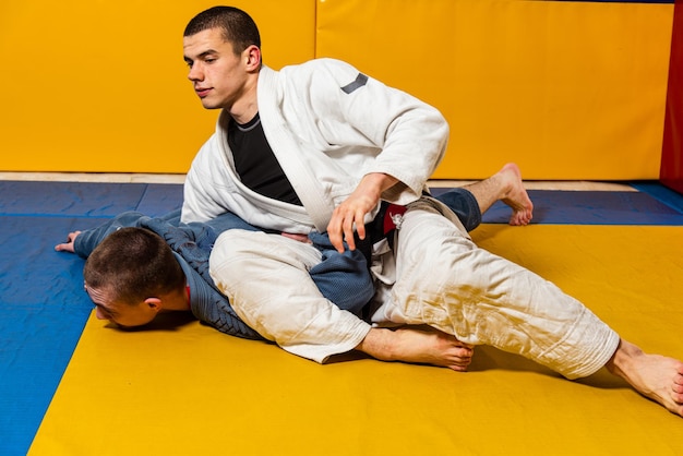 Brazilian jiujitsu and grappling training for men in a selfdefense gym