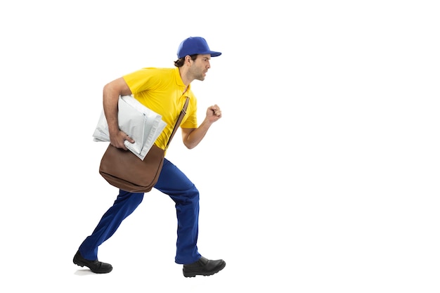 Brazilian mailman running with a package on a white background. copy space.