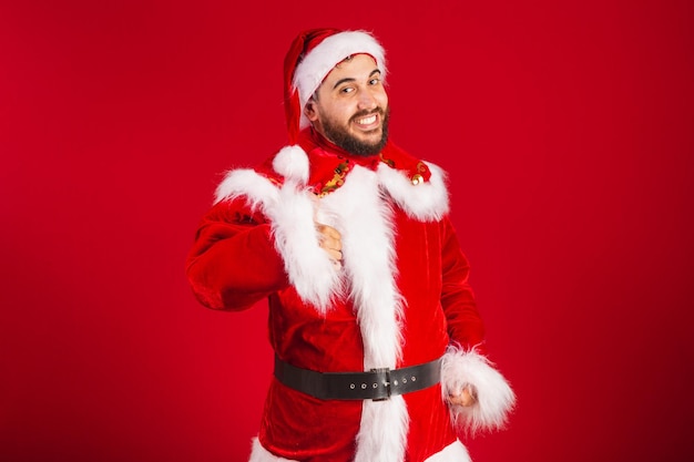 Brazilian man dressed in santa claus clothes like sign