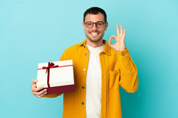 Brazilian man holding a gift