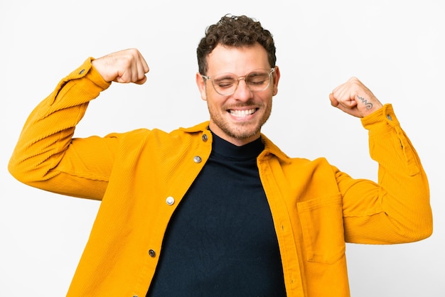 Brazilian man over isolated white background doing strong gesture