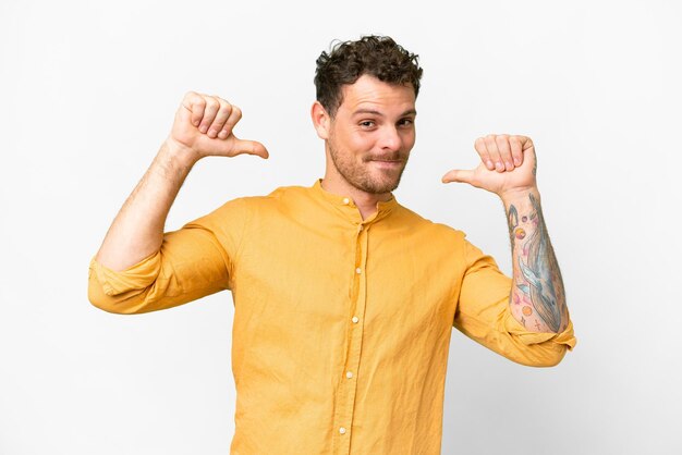 Brazilian man over isolated white background proud and selfsatisfied