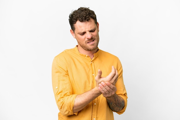 Brazilian man over isolated white background suffering from pain in hands