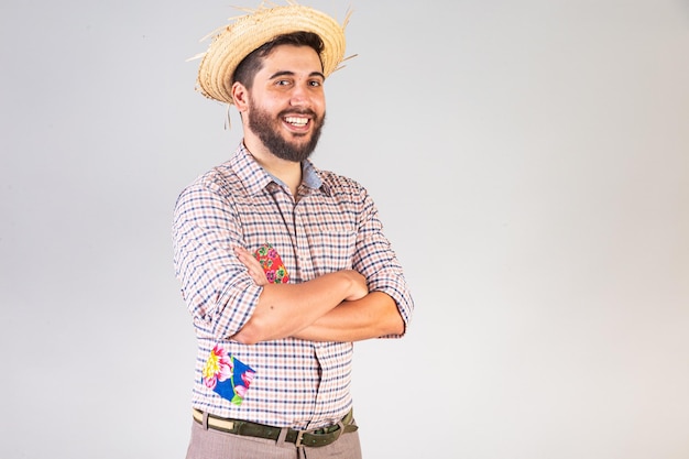 Brazilian man wearing festa junina clothes Arraial Feast of Saint John crossed arms