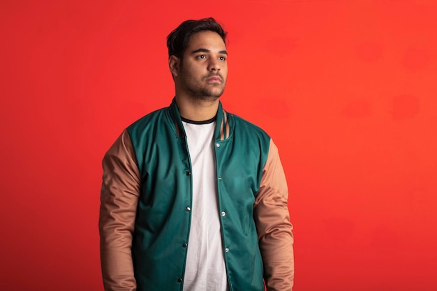 Brazilian man wearing jacket and making facial expressions