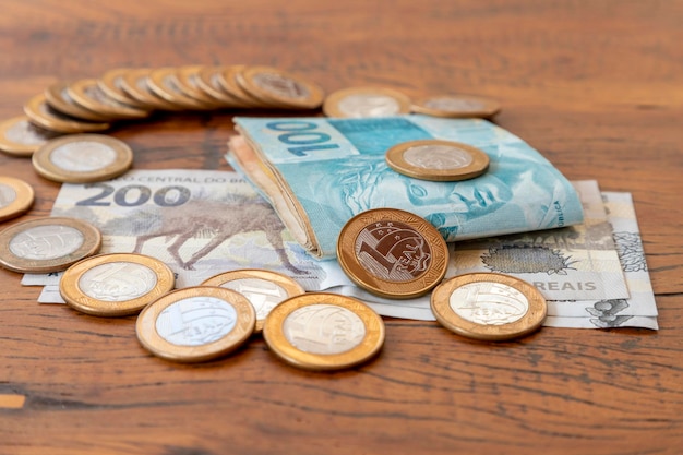 Brazilian money in banknotes and coins on the table