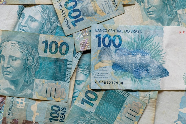 Brazilian money scattered on the table