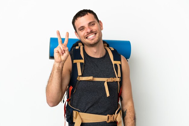 Brazilian mountaineer man with a big backpack