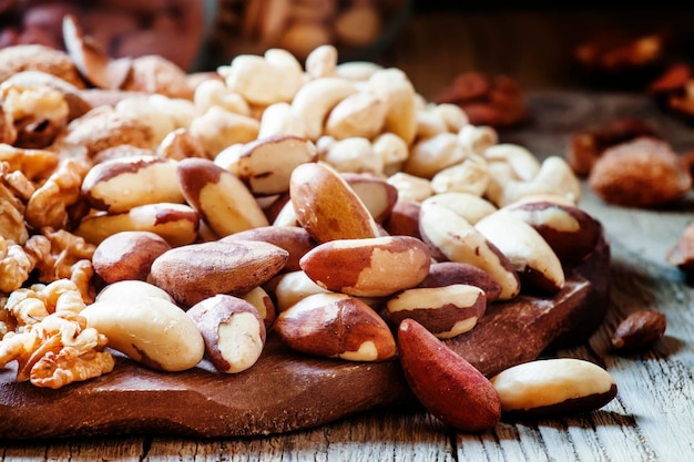 Brazilian nut nut mix vintage wooden background selective focus