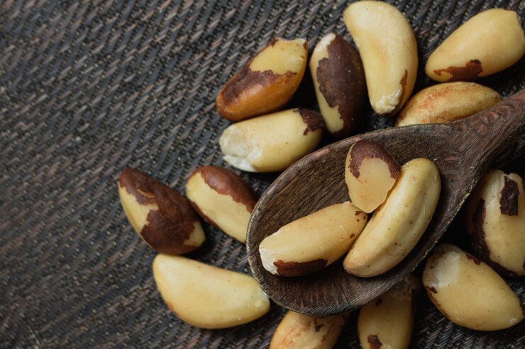 Brazilian nuts in a bowl on a wooden table