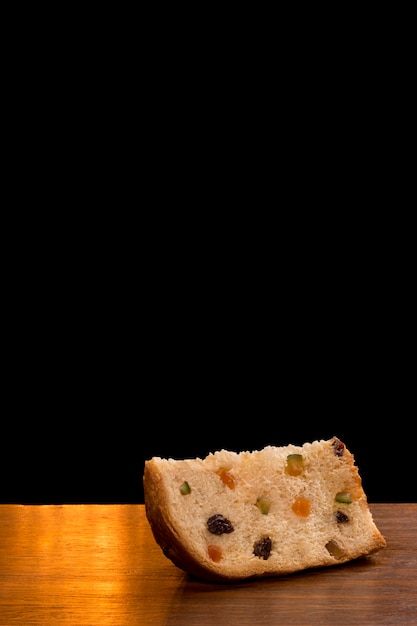 Brazilian panettone, a traditional pastry in Brazilian with a black wall.