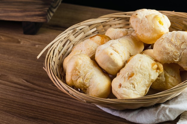 Brazilian Pao de queijo fresh cheese breads on rustic wood Selective focus