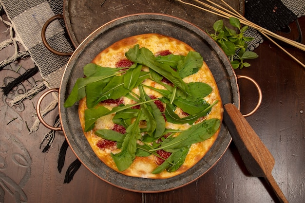 Brazilian pizza with sun-dried tomatoes, arugula and mozzarella. Traditional Brazilian Pizza