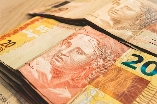 Photo brazilian real banknotes in closeup for brazilian economy concept