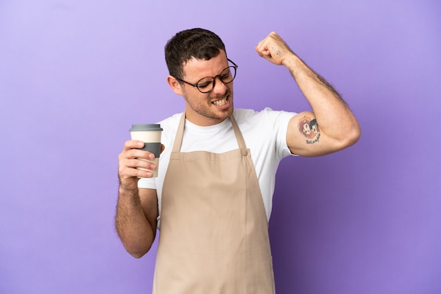 Brazilian restaurant waiter over isolated purple background celebrating a victory