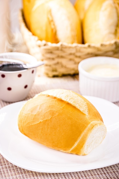 Brazilian salt bread served for breakfast called french bread crispy and fresh from the oven served with hot black coffee