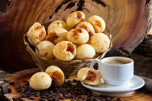 Brazilian snack cheese bread stuffed with pepperoni and a cup of coffee