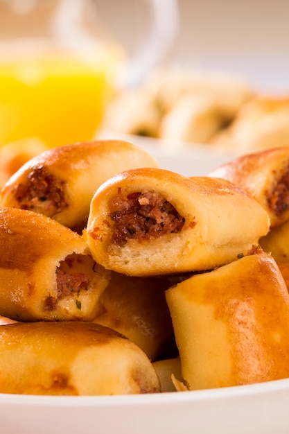 Brazilian snack. Pepperoni snacks portion on the table.